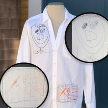 Load image into Gallery viewer, white button up blouse with custom embroidery of kids drawing of smiling stick figure man with sunglasses and multicolored soccer goal net