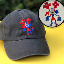 Load image into Gallery viewer, black baseball hat with custom embroidery of kids drawing of robot transformer in red gray and blue thread