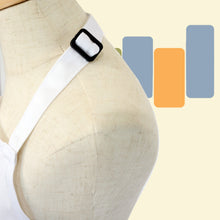 Load image into Gallery viewer, close up detail of black size adjustment slider on neck of apron