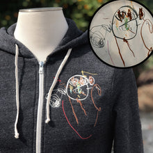 Load image into Gallery viewer, heather gray zip up hoodie with embroidery on left chest.  embroidery is of a child's drawing of a squiggly man with a round head and stick limbs