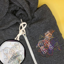 Load image into Gallery viewer, heather gray zip up hoodie with custom embroidery on left chest.  embroidery is of a childs coloring book page with colorful scribbles
