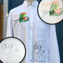 Load image into Gallery viewer, white button front shirt with neon green roller skate embroidery on chest and family of stick figures embroidered with black thread on hip
