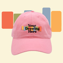Load image into Gallery viewer, baby pink baseball hat with &quot;your drawing here&quot; text on front

