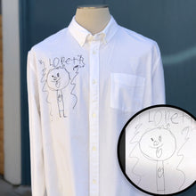 Load image into Gallery viewer, white button up shirt with custom embroidery on right chest.  the embroidery is of a line drawing of little girl &quot;loretta&quot; with a heart on her shirt, embroidered  in black thread
