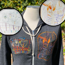 Load image into Gallery viewer, gray zip up hoodie with custom childrens drawings embroidered.  left chest is an orange and purple amoeba and right chest is a yellow and white heart family smiling over a red fence
